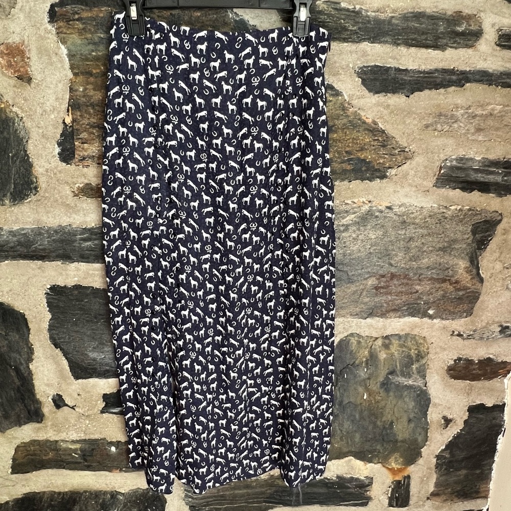 Maje little horses print in ecru on a navy background.